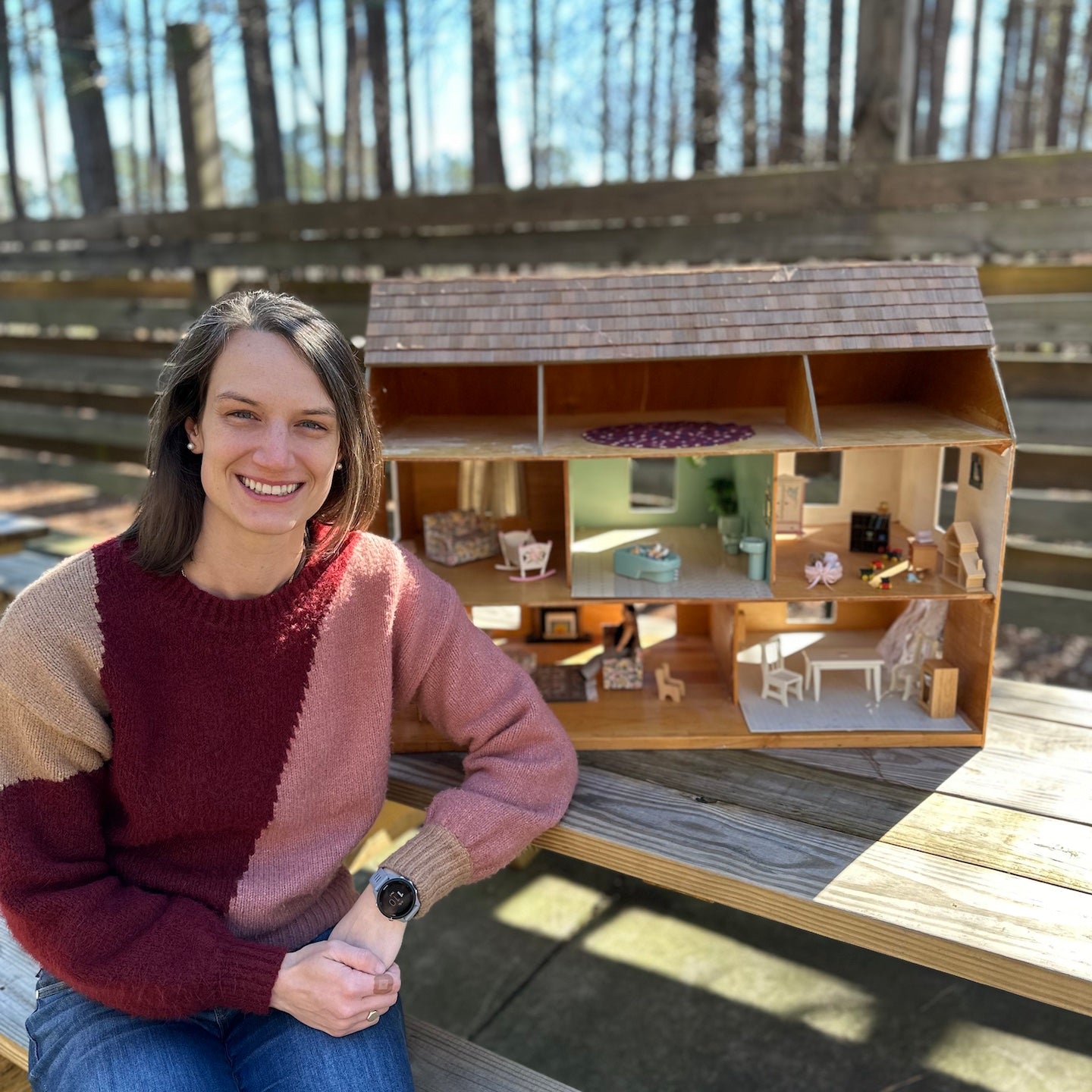 Catherine Bhattachar with her childhood dollhouse