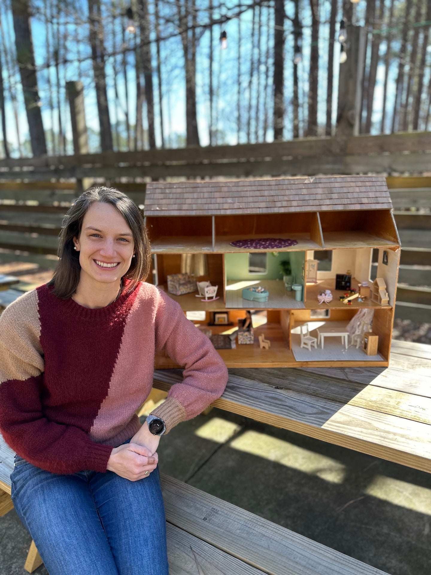 Catherine Bhattachar with her childhood dollhouse